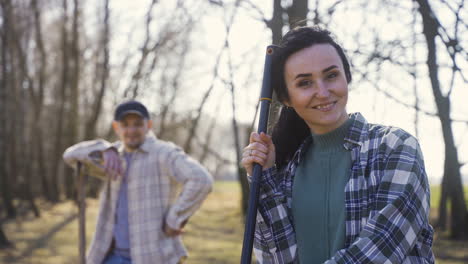 caucasian couple working in the countryside. then they smiling and looking at camera