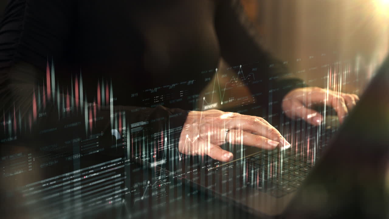 Close-up of a businesswoman typing on a laptop in a warmly lit room. Animated motion graphics and dynamic infographics float across the screen, visualizing real-time data analytics