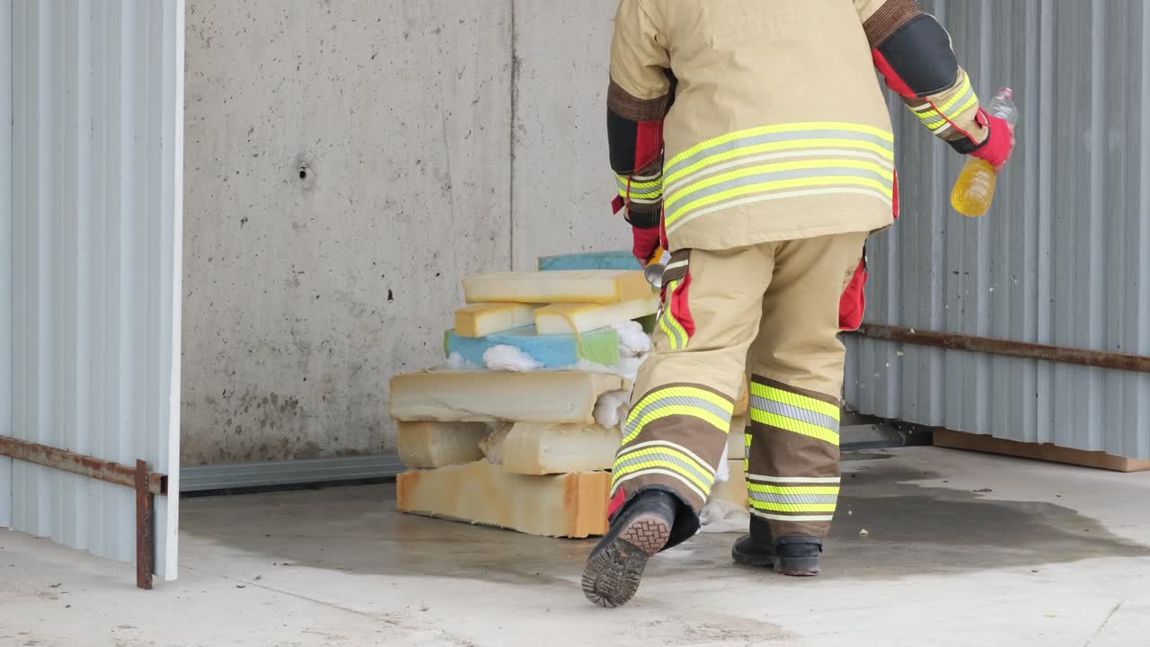 Firefighter Preparing Flammable Materials for Fire Test