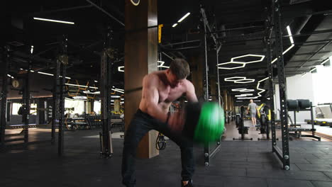workout routine in gym. young handsome man doing exercises in the gym