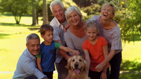 happy family with their dog in park