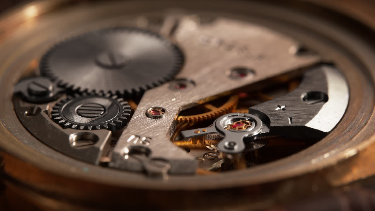 Mechanism of the Old Rusty Wristwatch - Golden Parts of the Working Watch Move in Macro and Slow Motion