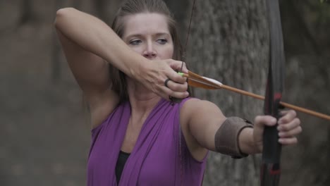 A-lady-archer-pulls-her-bow-up-and-aims-for-the-shot