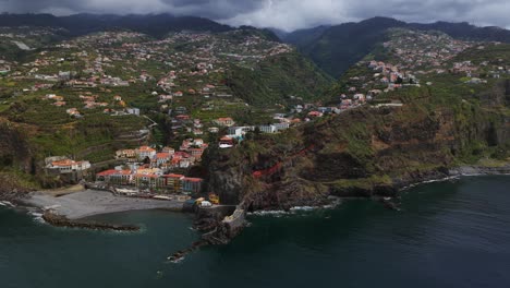 ponta do sol municipality and beach by the sea in madeira island, portugal. - aerial shot