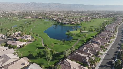 Heritage-Palms-Golf-Course-in-Indio,-California-with-drone-video-pulling-back