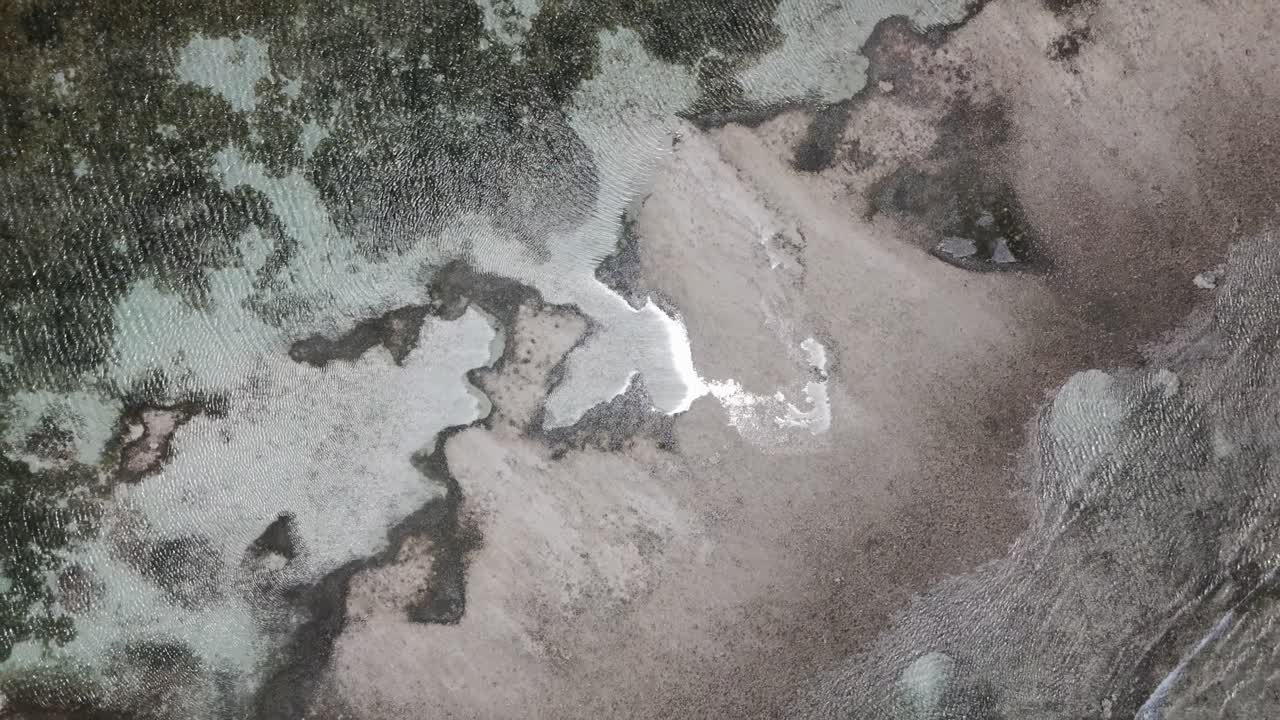 Above View Of Seashore Meets Low Tide River In Antigua Islands. Aerial Ascending Shot