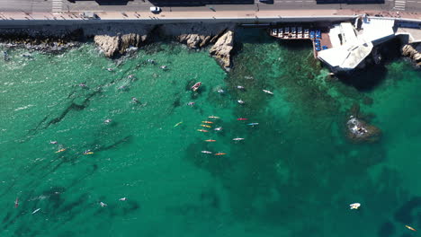 aerial top shot of kayaks and swimmers in the mediterranean sea marseille france