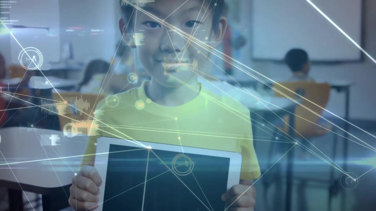 Boy lifting head from blank tablet in classroom, activating network graphics illustrating data flow