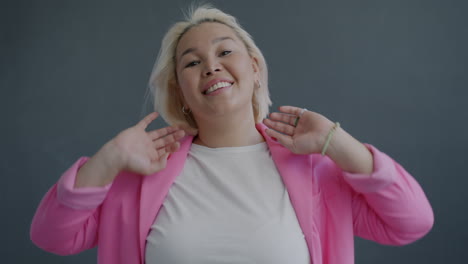 plus-size woman in a pink blazer