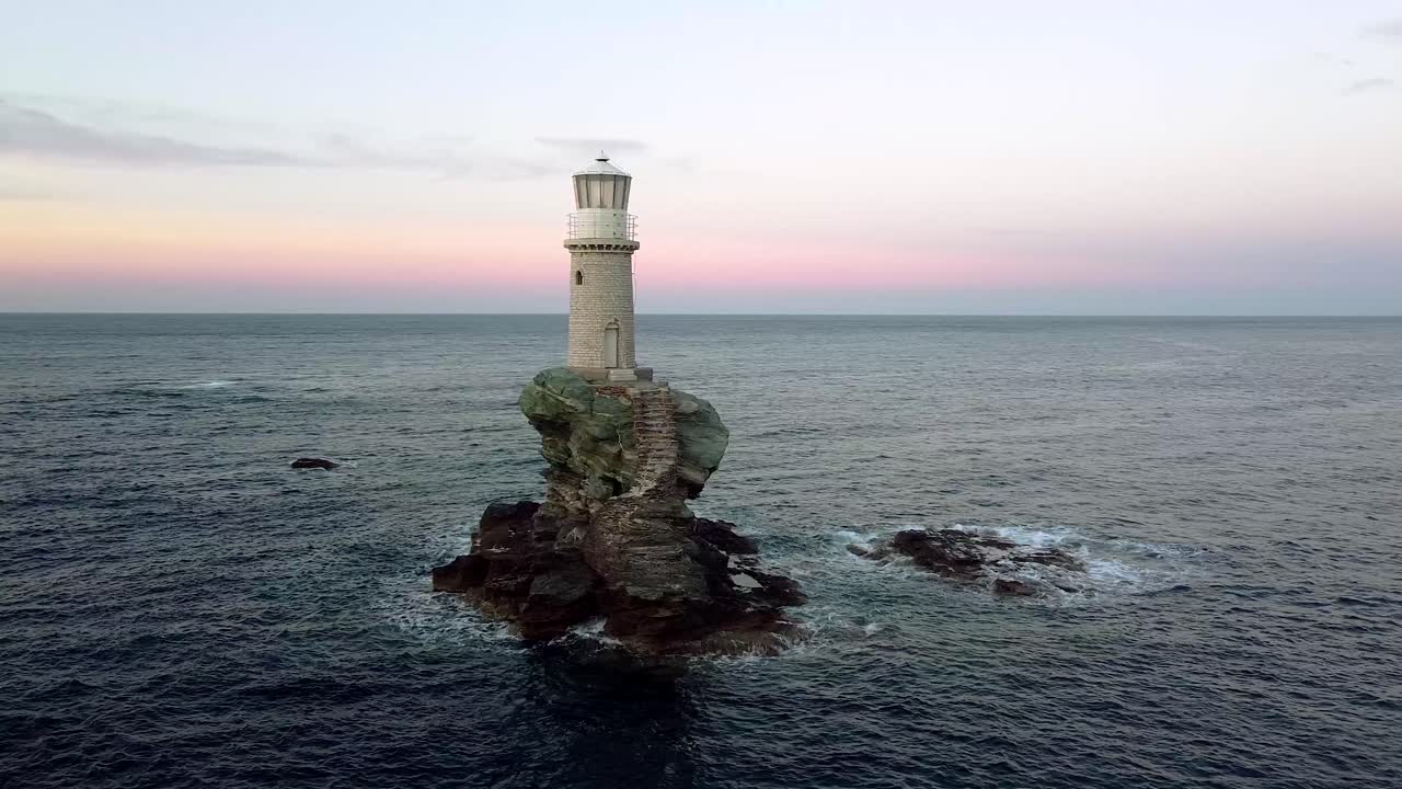 Orbit View of Ancient Chora of Andros Tourlitis Lighthouse at Twilight, Greece
