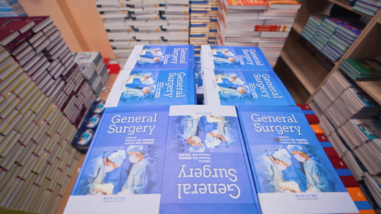 Stack of books background. View between the rows of bookshelves