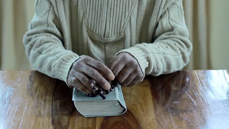 praying-to-God-with-bible-faithfully-worshipping-with-people-stock-footage-stock-video