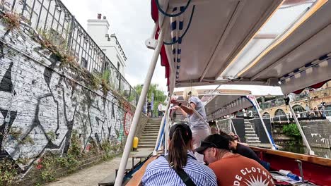 tourists enjoy a scenic canal boat ride