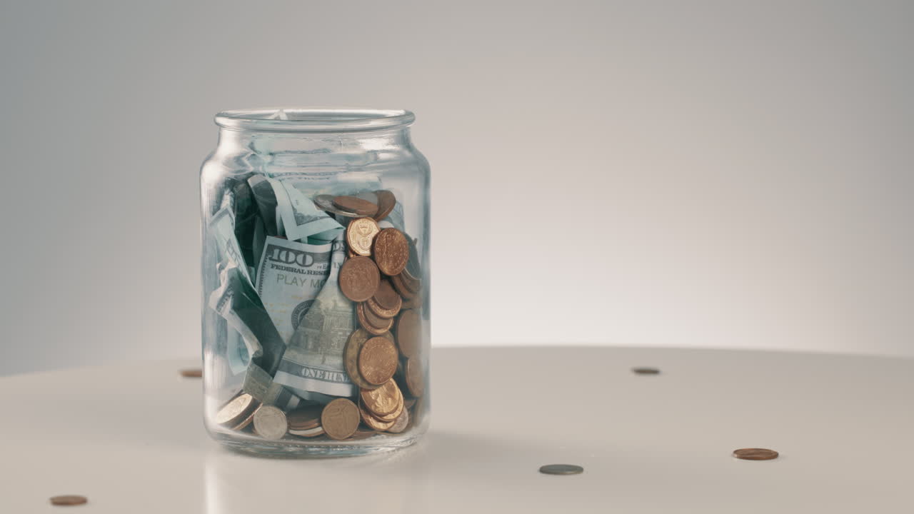 Money, savings and a glass jar for budget