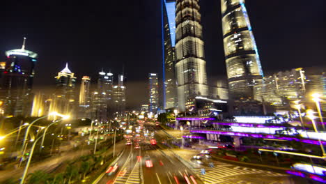 Timelapse of the Shanghai city skyline with traffic passing at nigh