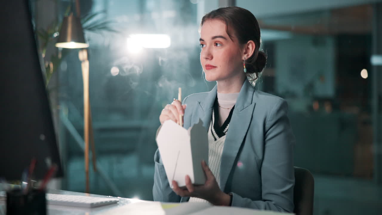 Businesswoman Eating Takeout at Desk