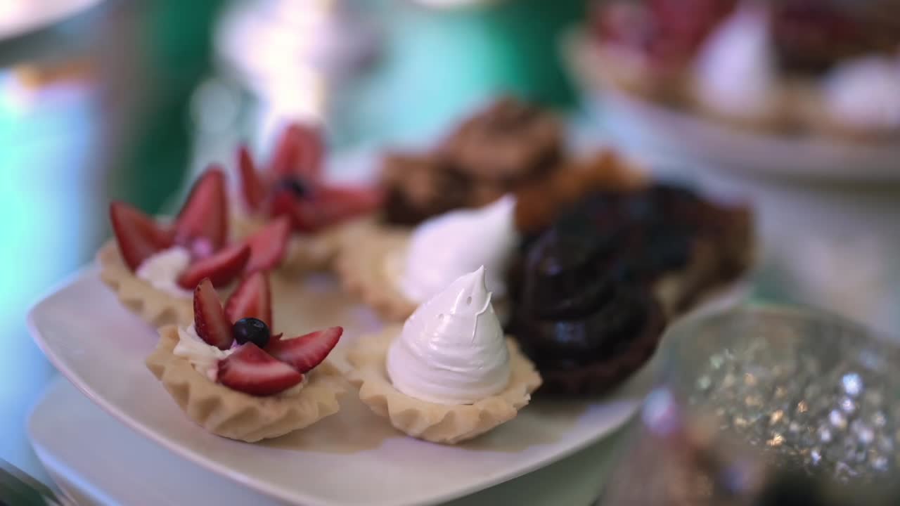 Close-up of assorted gourmet mini desserts displayed on an elegant table