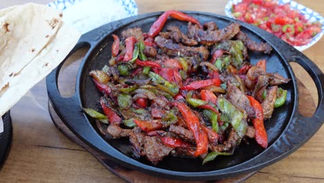 close up of a delicious skillet of fajitas