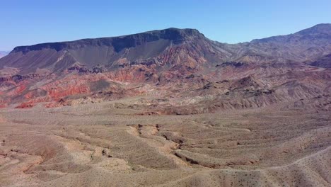 Aerial-view-overlooking-layers-of-mountains-and-sand-dunes-at-Kingman-wash-in-sunny,-USA---panoramic,-drone-shot