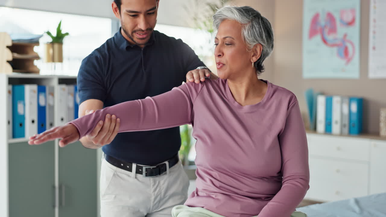Physical Therapist Examining a Patient's Shoulder