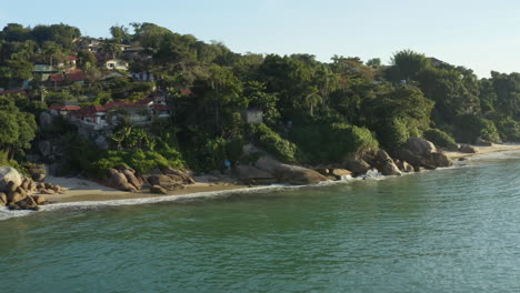 aerial view of sea waves and ocean sunset a fantastic rocky coast, jurere internacional, florianopolis, santa catarina, brazil
