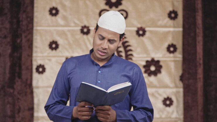Indian muslim man reciting a poem in front everyone