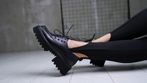 stylish black platform shoes with leggings