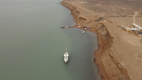 la guajira peninsula remote desert coastline, aerial drone nature landscape colombia, abandoned boat