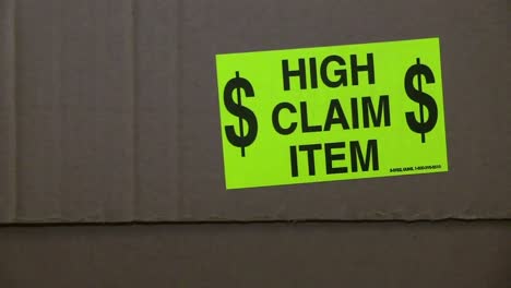 neon green high claim item label on side of carton box for shipping