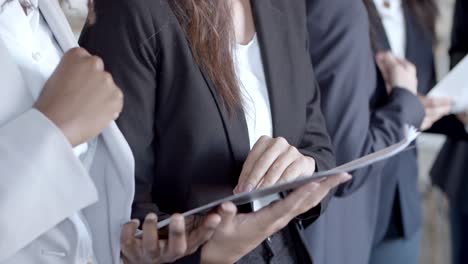 focused businesswomen reading contract