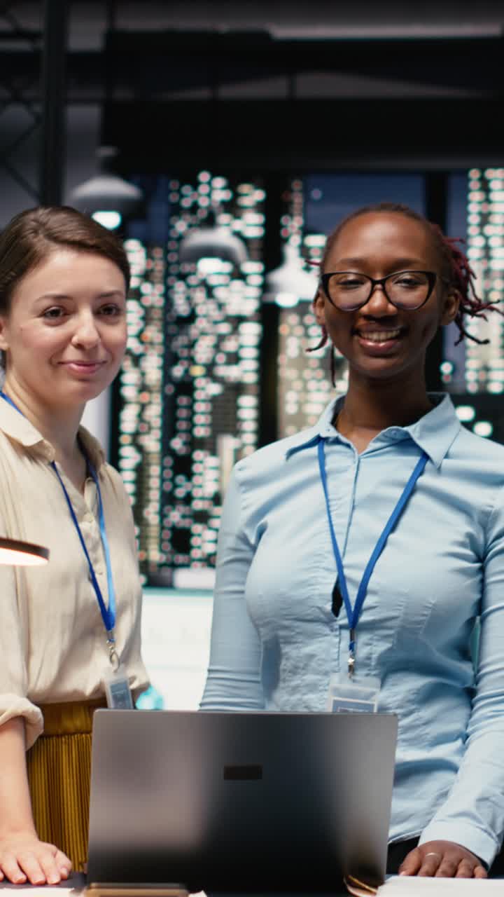 Vertical Video Diverse coworkers portrait, working late in office, collaborating on strategy