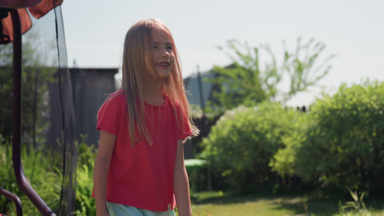 Young Girl Investigates Dandelion In Sunlight, Fairskinned Girl Observes Dandelion With Net Outdoors Happily, Caucasian Child Explores And Catches Dandelion Using Net In Sunny Garden