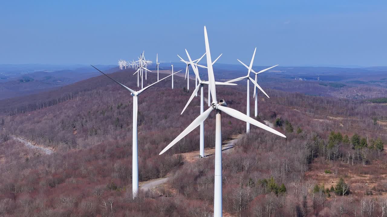 Close View of Tall Wind Turbines Generating Power on Appalachian Ridge in Spring, Mountaineer Wind Energy Center, Thomas, West Virginia