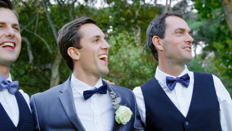 groom and groomsmen happily hugging, talking 4k 4k