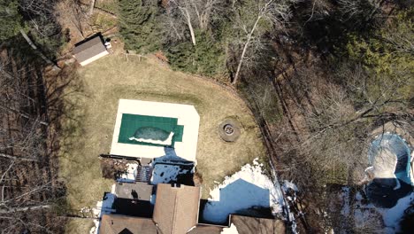 a suburban yard from the air in late winter