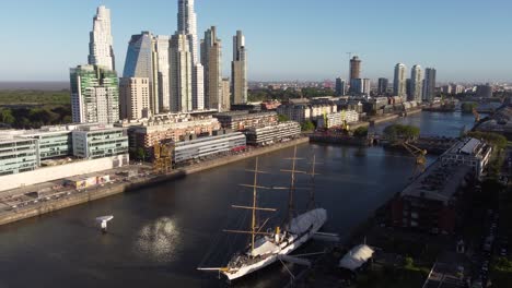 Drone-view-of-sailing-ship-in-city-park-at-Puerto-Madero-area-in-Buenos-Aires-Argentina