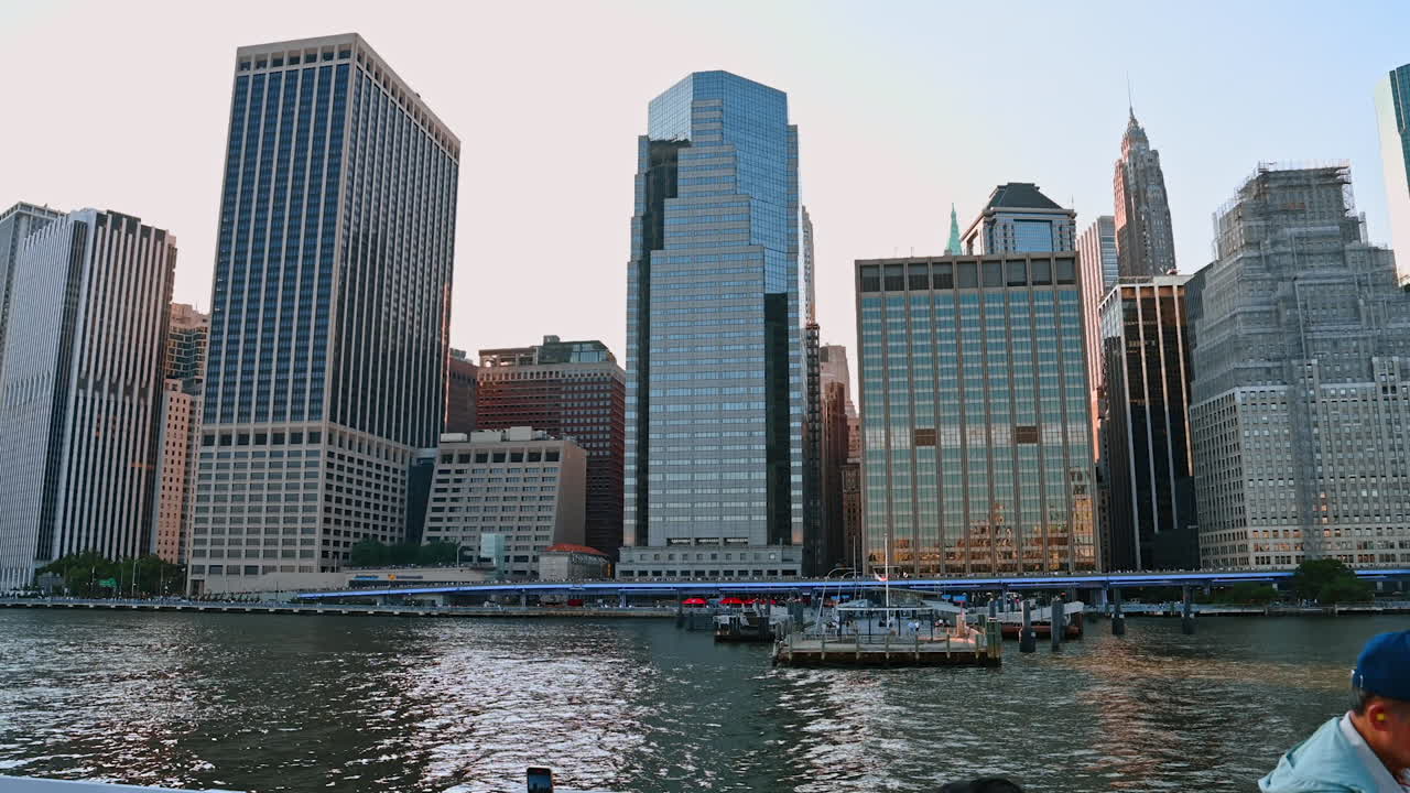 NEW YORK - AUGUST 2014: Cruise yacht with Manhattan skyline in the background on August 11, 2014. Manhattan is the central part of NYC. It is one of the worlds leading cultural and economic centers