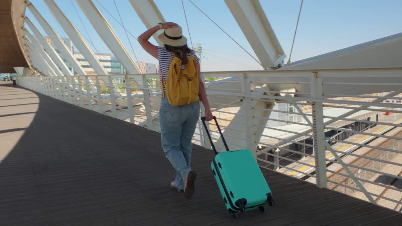 Woman with Backpack Crossing Passenger Bridge at Terminal