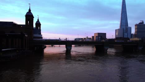 aerial - epic overview of the river thames and many bridges, london, england, forward