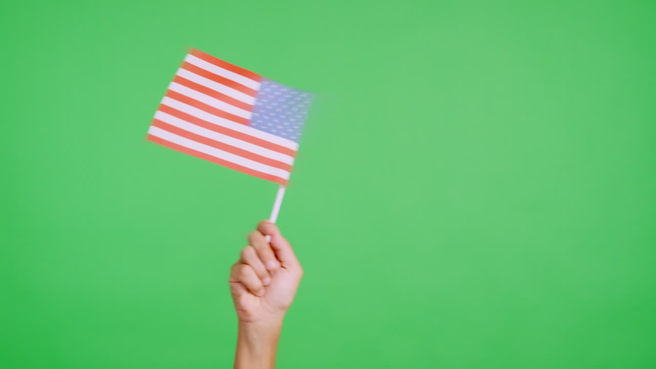 Hand waving a pennant of a United States flag