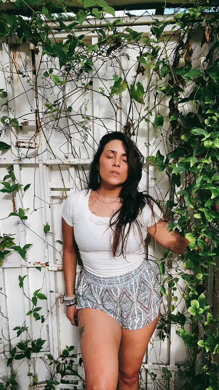 Woman Relaxing in a Garden Setting