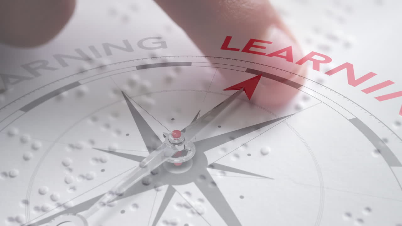 aprendiendo la brújula en braille.