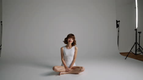 studio portrait of a woman sitting