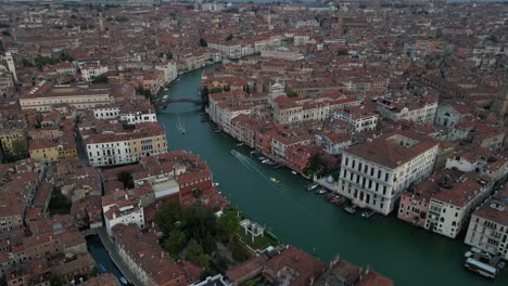 aerial shot showcasing the winding grand canal surrounded by historic venetian buildings.