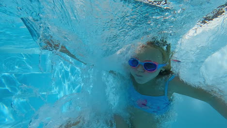 girl jumps into pool with spin - slow motion