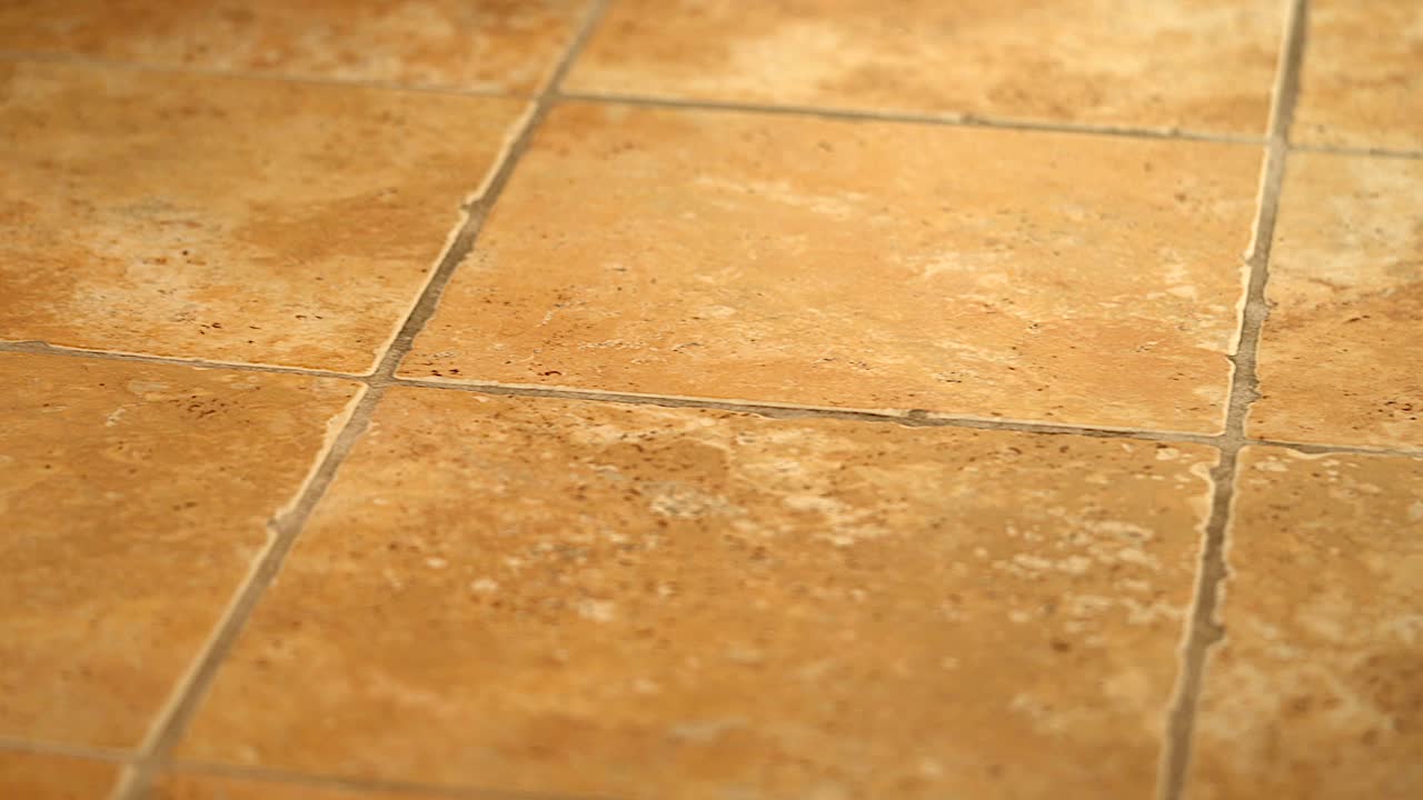 Cinematic prospective 4k shot of bathroom tile floor