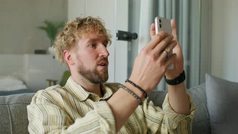 man using smartphone for video call