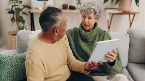 Tablet,-relax-and-search-with-old-couple-on-sofa