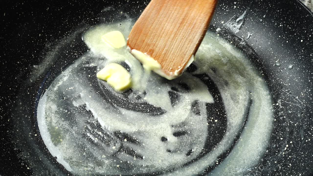 Butter on a frying pan with non-stick coating