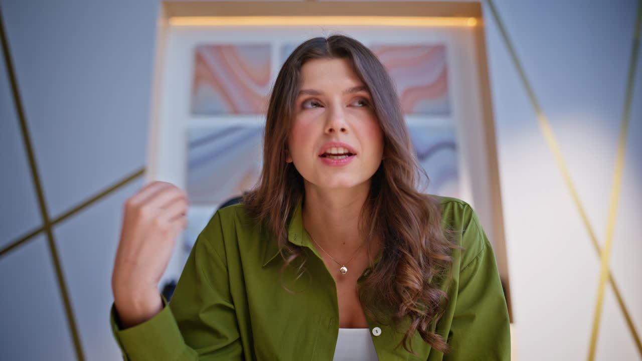 A collection of portraits of a young woman in a green shirt